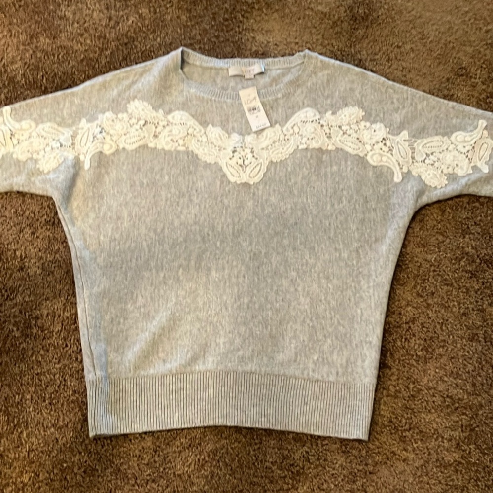 LOFT. GRAY SWEATER. SIZE MEDIUM. LOVELY LACE DESIGN ACROSS THE FRONT. NWT